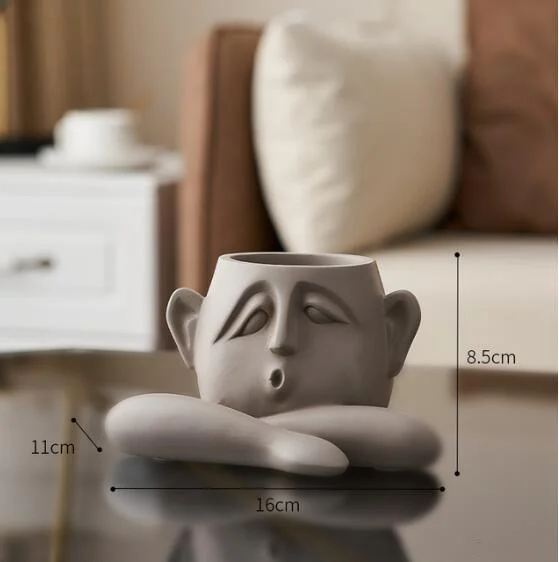 Flower_Pot_with_Abstract_Figure_Decoration_-_-4190216 Flower Pot with Abstract Figure Decoration -
